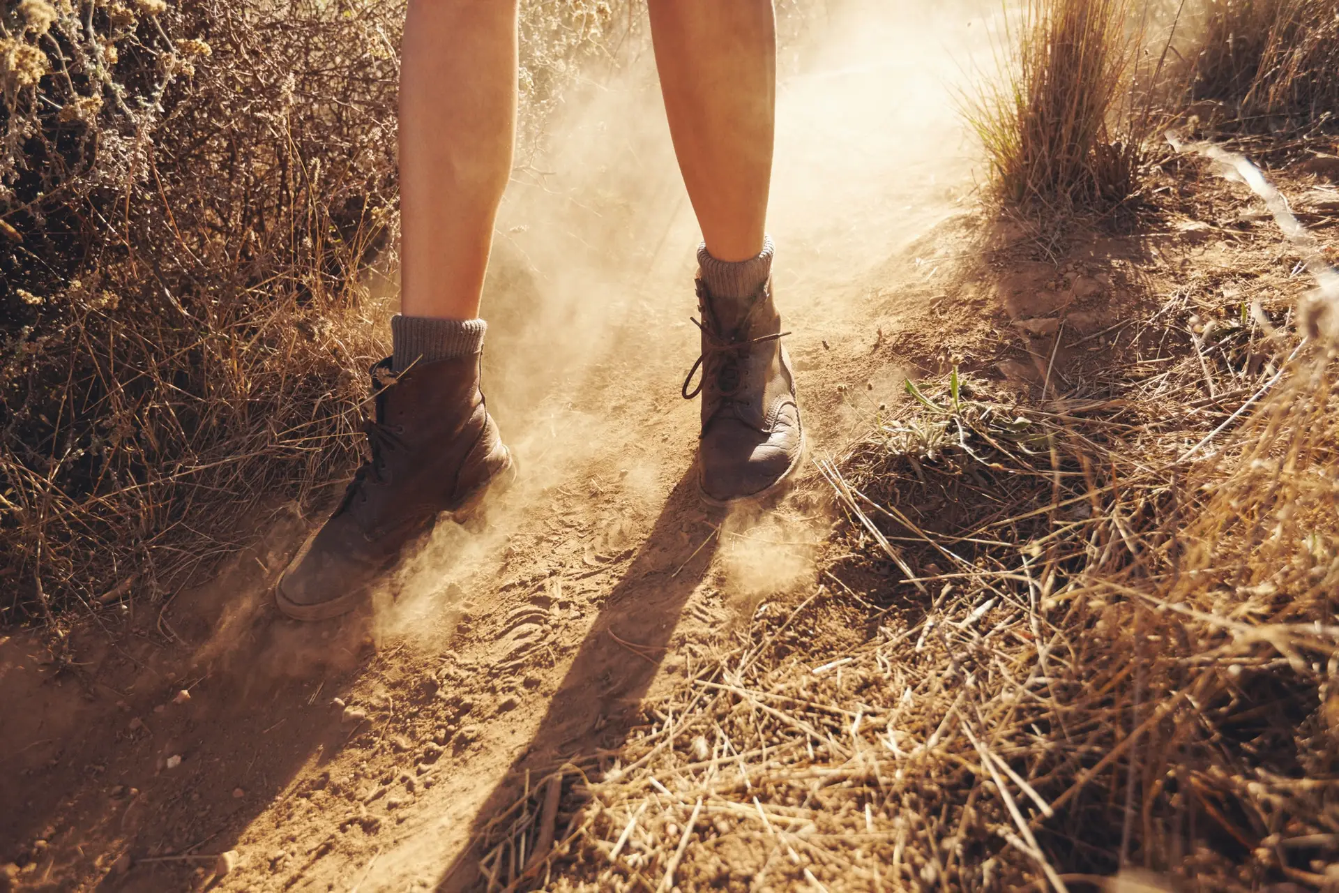 Young woman hiking on a mountain trail